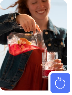 women pouring drink in glass.